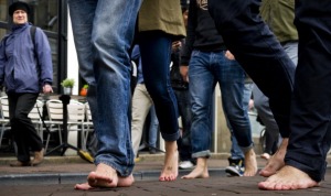 Participants of the One Day Without Shoes walk barefoot through Amsterdam.  to raise awareness for children without shoes, on April 10, 2012. 